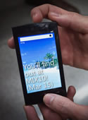 Hands holding a Win 7 phone