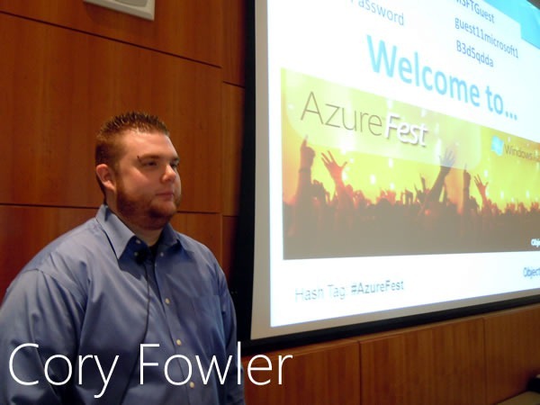 Cory Fowler stands beside the big screen in Microsoft Canada's MPR room