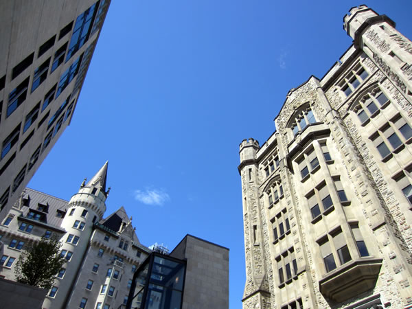 The tops of Chateau Laurier and buildings on its east side