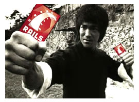 Bruce Lee, brandishing "Rails" nunchucks