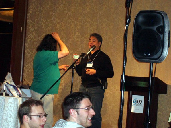 Joey deVilla showing his Microsoft corporate credit card to Richard Stallman