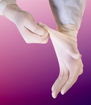 Hands in hospital latex gloves