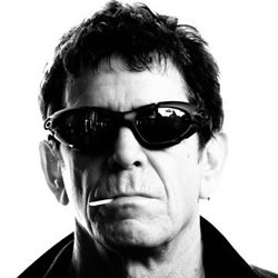 Lou Reed, in sunglasses, with a cigarette