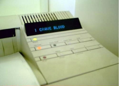 Printer displaying the message "I CRAVE BLOOD"