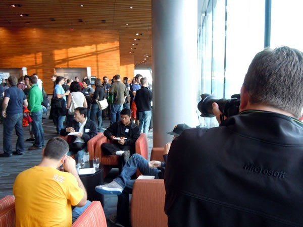 A crowd of CloudCamp attendees gathering as John Bristowe takes a photo of them