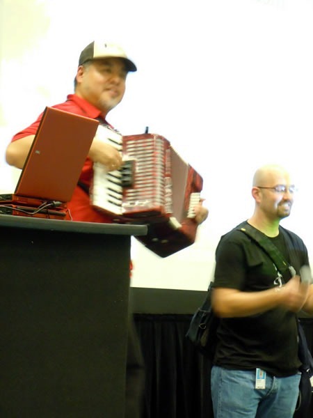 Joey deVilla plays his accordion at Go DevMENTAL as Andrew Gottlieb stands beside him