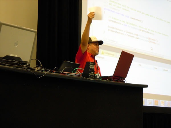 Joey deVilla makes his presentation, holding up a piece of paper