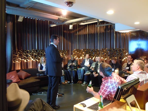 Arnaud Gabaudan makes a quick speech to the attendees in the lounge area of Glowball Grill