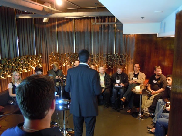 Arnaud Gabaudan makes a quick speech to the attendees in the lounge area of Glowball Grill as John Bristowe watches