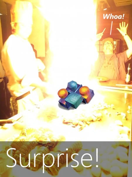 "Surprise!" Rick Claus reels back in amazement from the flame-burst of a teppanyaki onion volcano