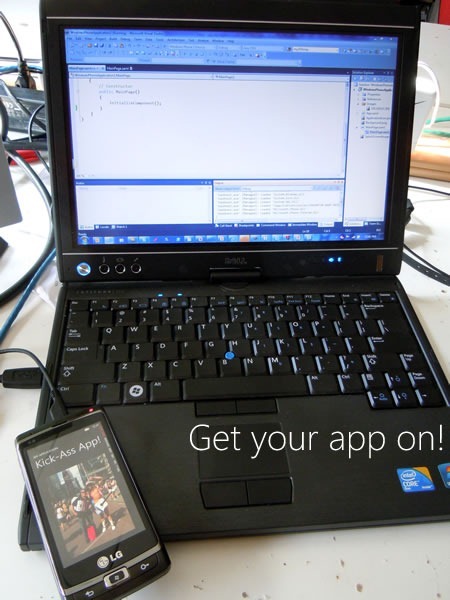 My laptop computer connected via USB to my Windows Phone 7 device, running "Kick-Ass App!"