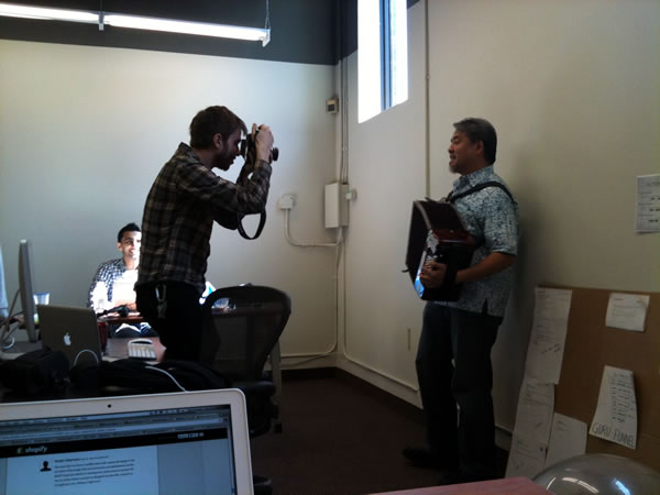 Ben Courtice taking photos of Joey deVilla as he plays accordion