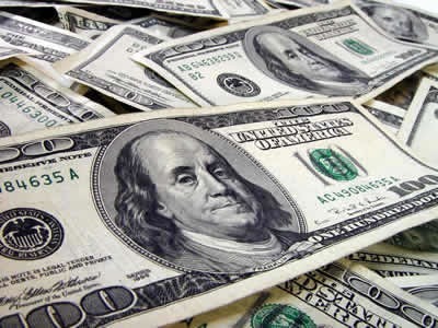 A scattered pile of $100 bills