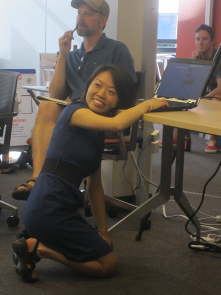 Developer ducks below the project as she makes a presentation