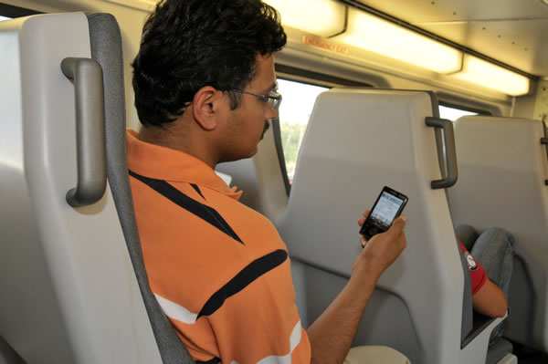 commuter with mobile phone