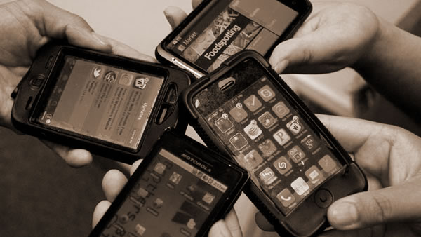 hands holding smartphones