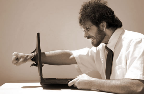 programmer punching through laptop screen