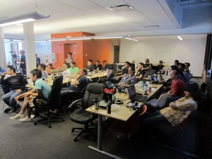 The HackVan attendees watching the presentations