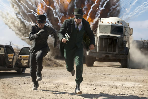 Green Hornet and Kato running away from an explosion