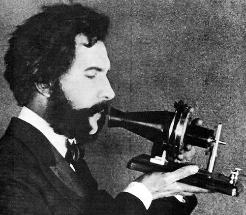 Photo: Alexander Graham Bell speaking into his telephone.