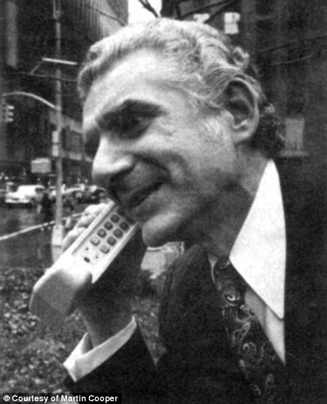 Photo: Martin Cooper on an old-style cellular phone.