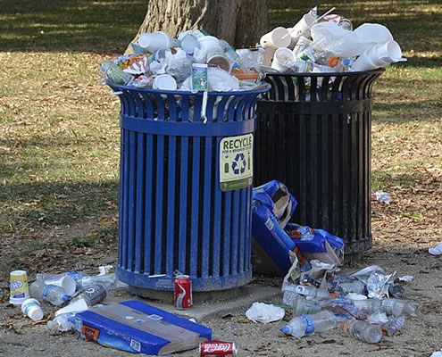 Photo: Overflowing trash cans.