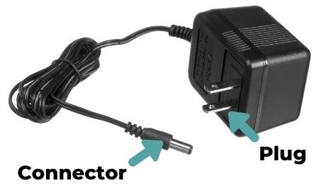 Photo of a power adapter, with arrows pointing out the connector and plug.