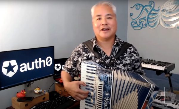 Joey deVilla plays accordion at the end of an Auth0 tutorial video.