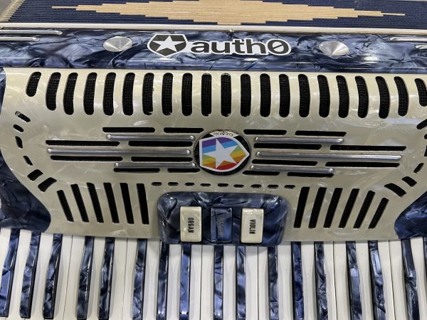 Joey deVilla’s blue accordion with Auth0 stickers.