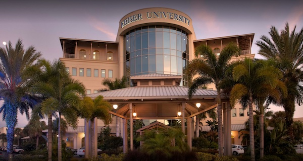 Keiser University Tampa’s building and palm trees.