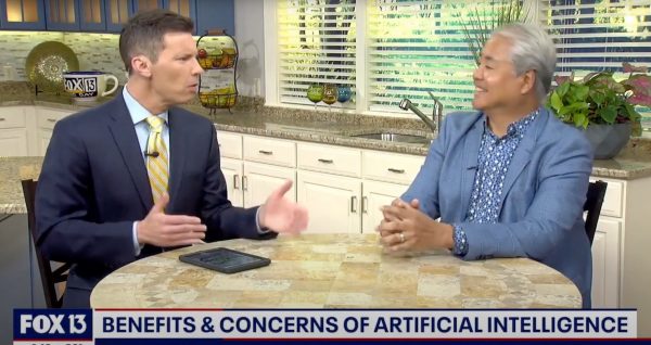 Chris Cato and Joey deVilla on Fox 13 News Tampa. The “lower third” caption reads “Benefits and concerns of artificial intelligence.”