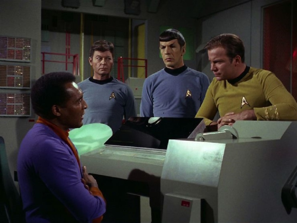 Photo: Richard Daystrom, McCoy, Spock, and Kirk, having a discussion around the M5 computer.